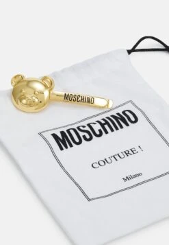 MOSCHINO Brooch - Otros Accesorios - Shiny Gold-Coloured 8 MOSCHINO Brooch - Otros Accesorios - Shiny Gold-Coloured -Tienda De Moda Femenina a98afab5a5644b53a4cc52d376d62f65